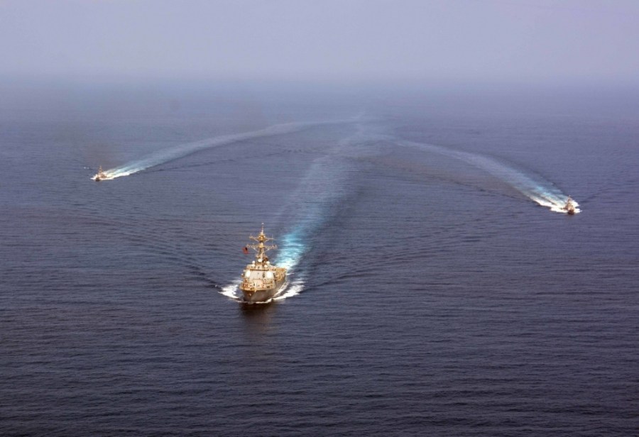 The guided-missile destroyer USS Mason (DDG 87) conducts formation exercises with the Cyclone-class patrol crafts USS Tempest and USS Squall.