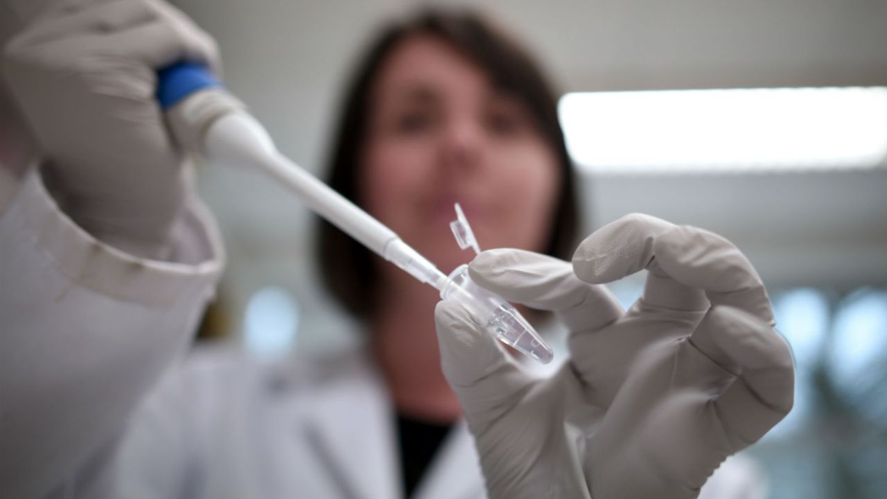 Scientist holds a pipette