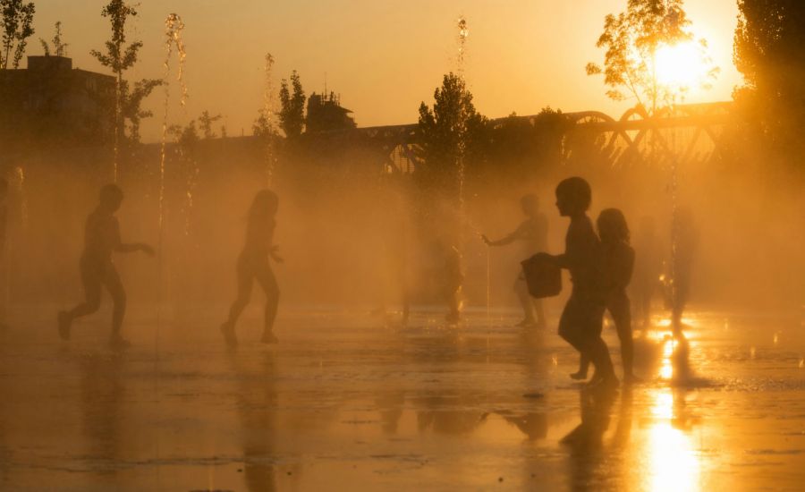 Photo of children playing in fountains