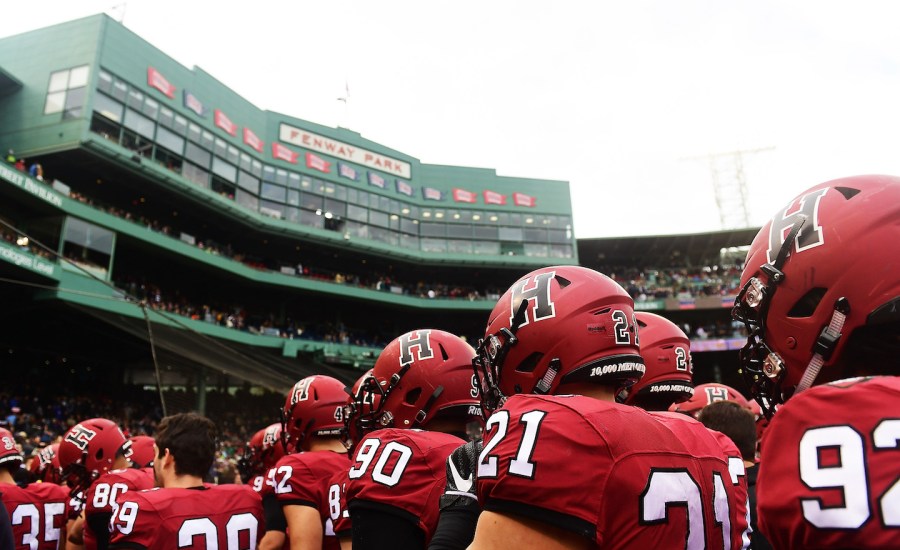 Climate change protesters stormed the field at a football game between Yale and Harvard