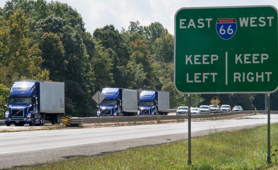 a photo of trucks on the road