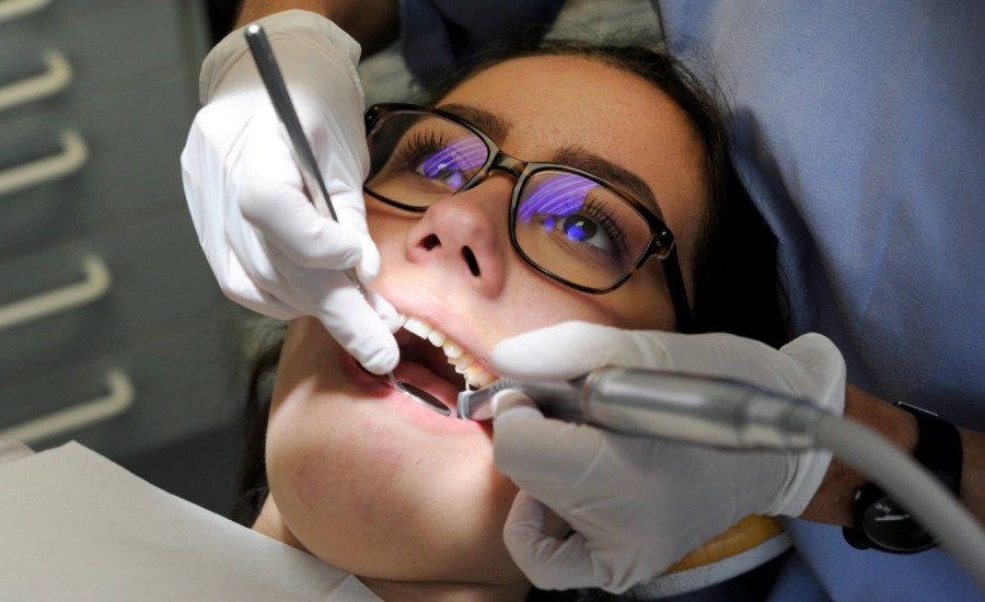 A woman gets dental work done