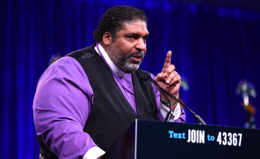 reverend barber speajs at a podium