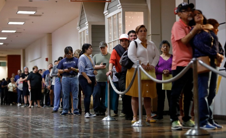 voters wait in a long line at a polling station in san antonio, texas