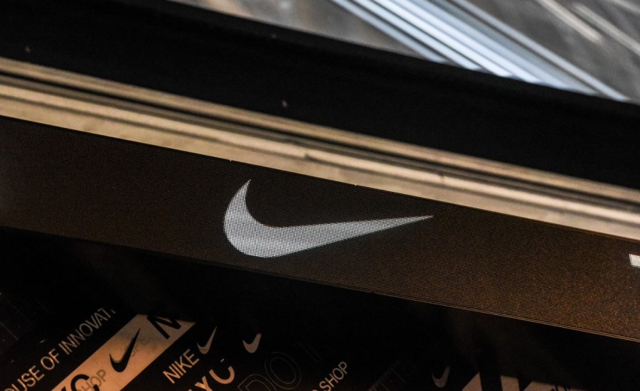 the nike logo on the side of a store