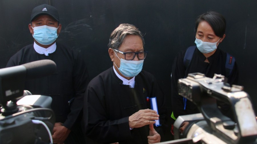 An attorney for Aung San Suu Kyi speaks to reporters