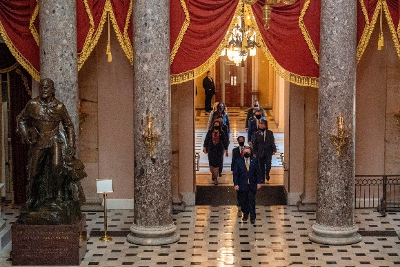 House impeachment managers walk through Capitol