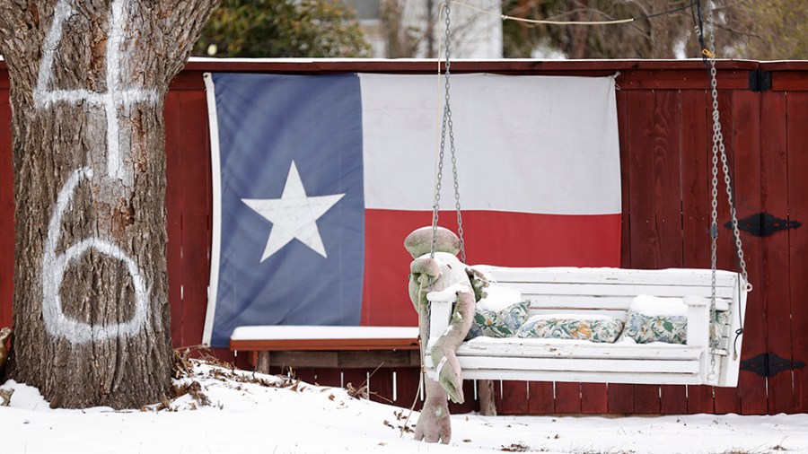 A snow-covered bench in Texas