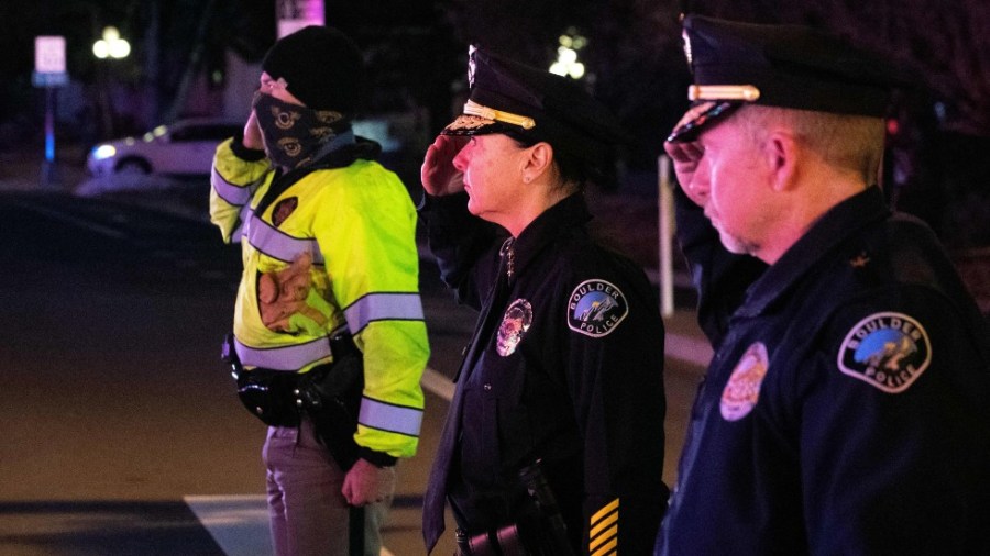 Boulder police officers salute