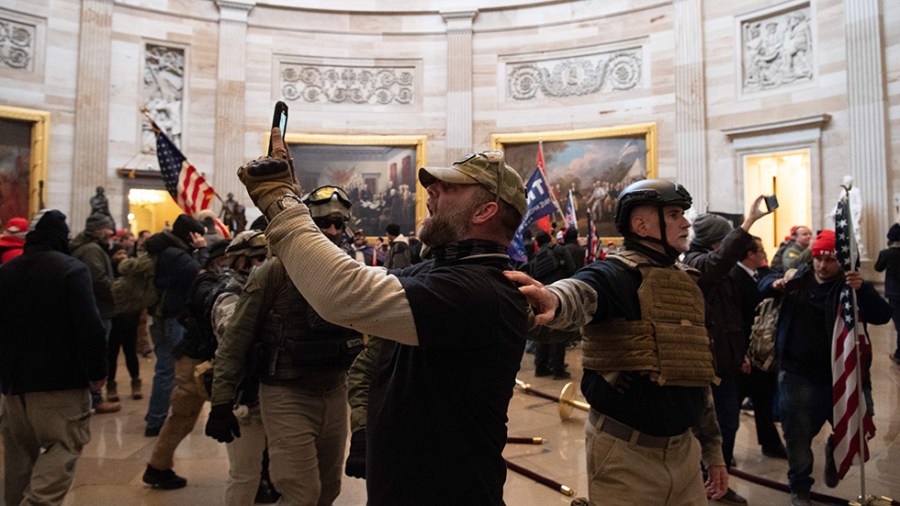 Rioters in U.S. Capitol use their phones