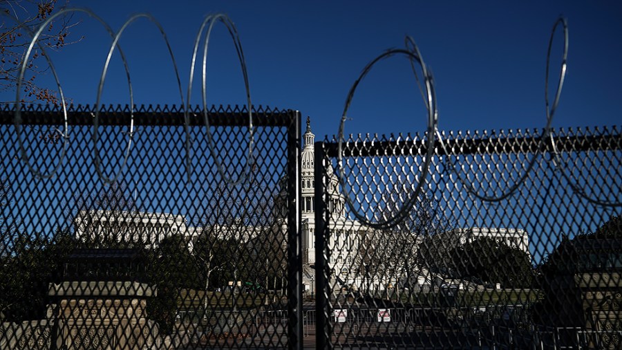 The U.S. Capitol is seen with fencing