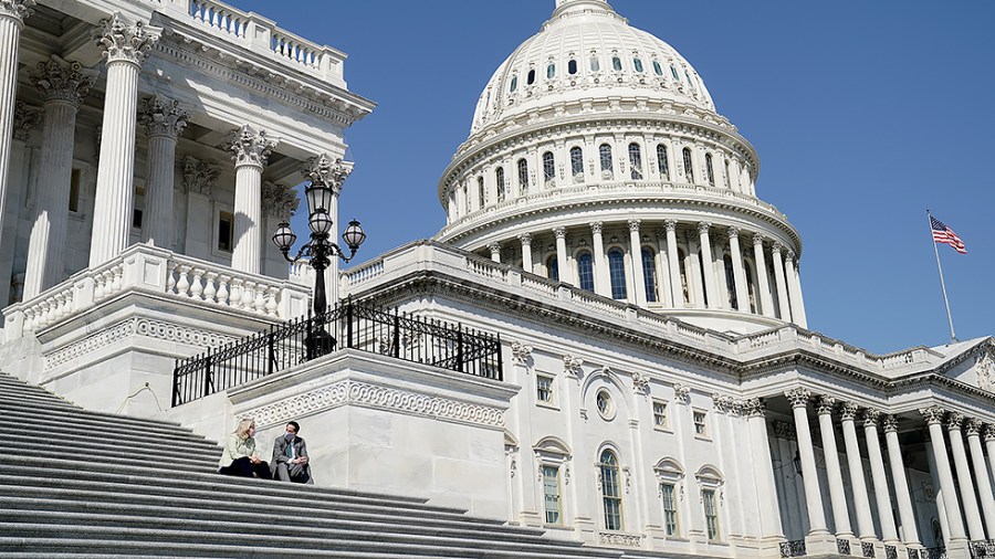 Rep. Liz Cheney (R-Wyo.) and Jamie Raskin (D-Md.) talk outside the House Chamber