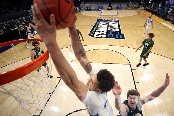 A Creighton basketball player scores