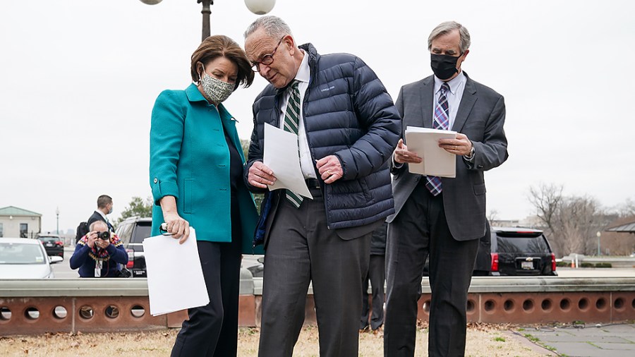 Majority Leader Charles Schumer (D-N.Y.), Sens. Amy Klobuchar (D-Minn.) and Jeff Merkley (D-Ore.)