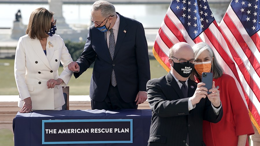 Speaker Nancy Pelosi (D-Calif.) and Majority Leader Charles Schumer (D-N.Y.) enroll the American Rescue Plan