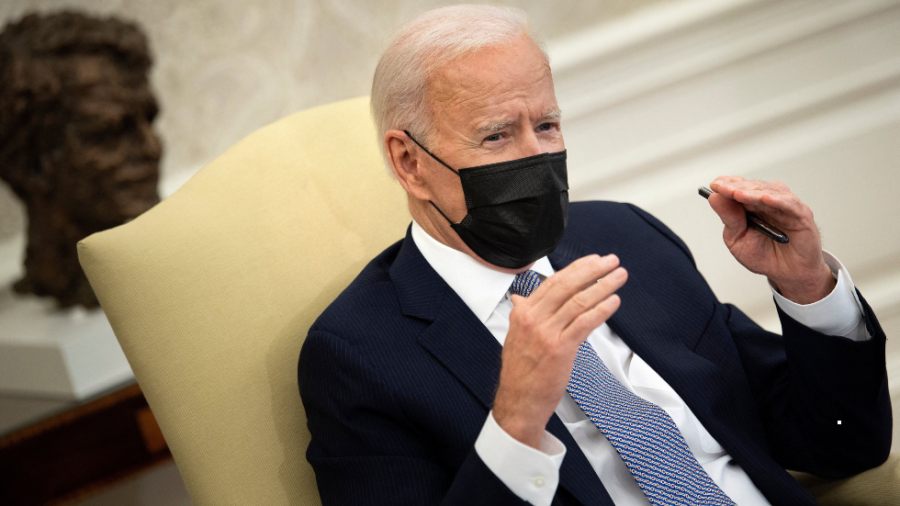 President Biden speaks with reporters in the Oval Office