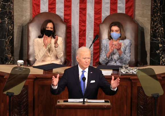 President Biden speaks as Vice President Harris and Speaker of the House U.S. Rep. Nancy Pelosi (D-CA) look on