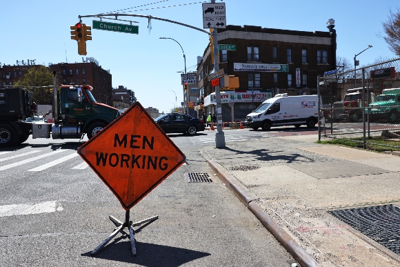 A "Men Working" sign