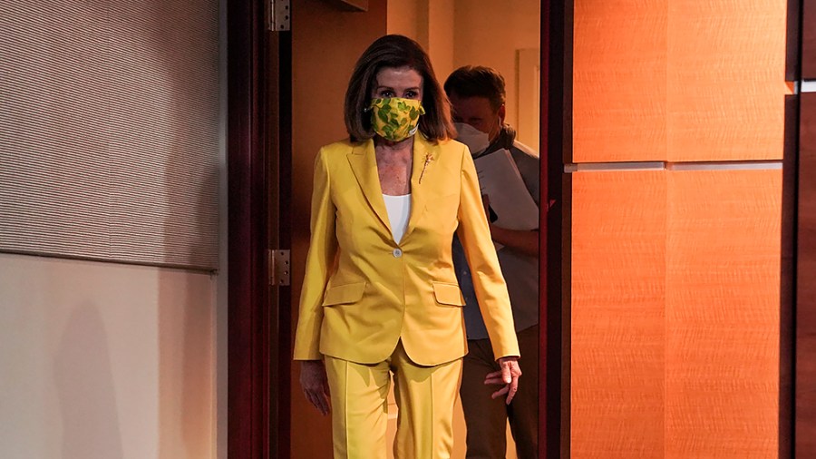 Speaker Nancy Pelosi (D-Calif.) arrives to address reporters at her weekly on-camera press conference