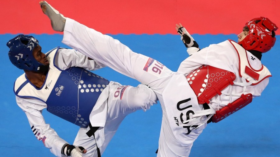 Rafael Alba of Cuba, at left, and Jonathan Healy of the U.S. spar in the Men's Over 80kg Final in taekwondo during the 2019 Pan American Games