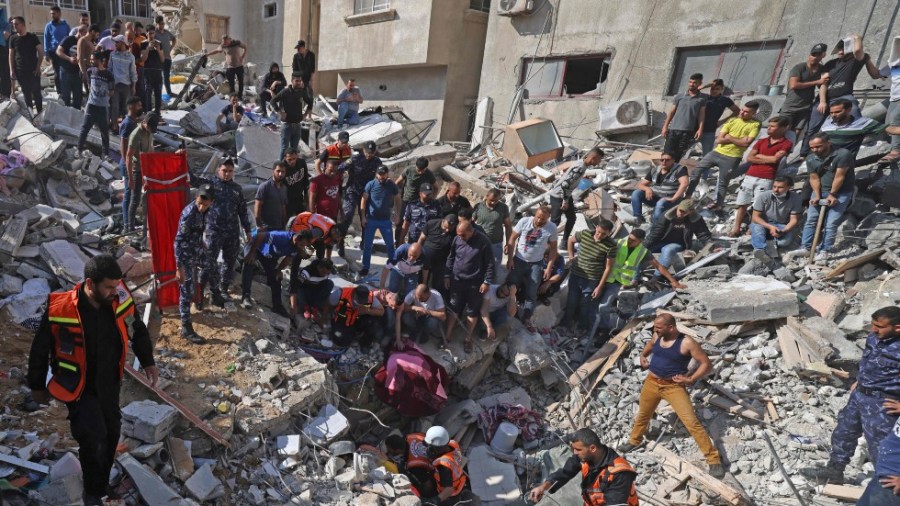 Rescuers search through rubble in Gaza City