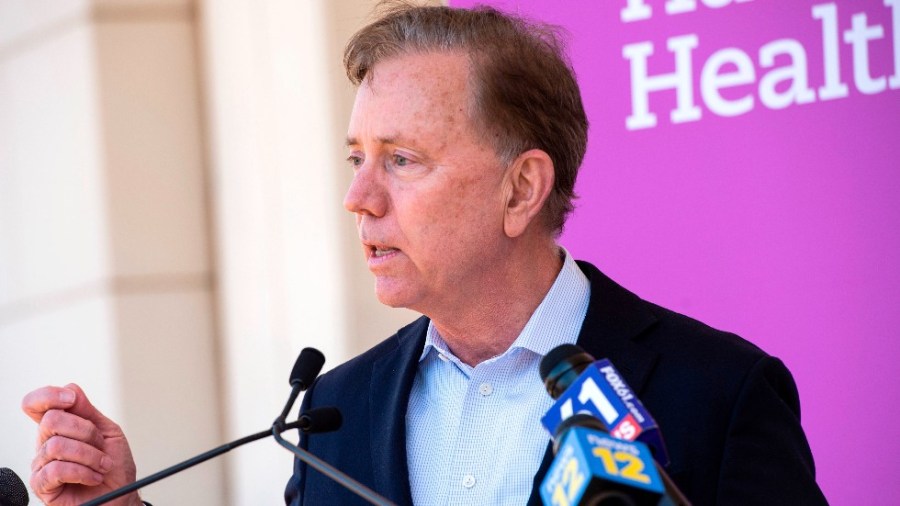 Connecticut Gov. Ned Lamont speaks about the state's efforts to get more people vaccinated at Hartford HealthCare St. Vincent's Medical Center in Bridgeport