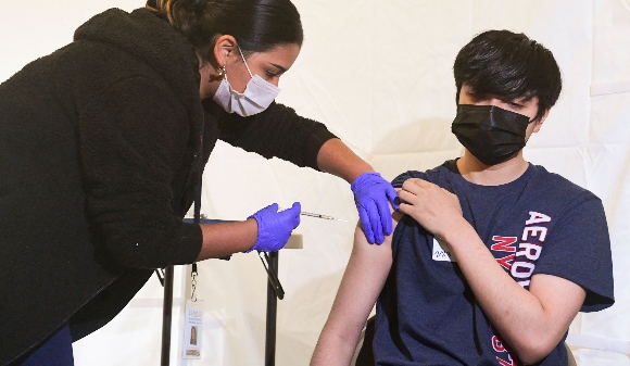 A youth is vaccinated