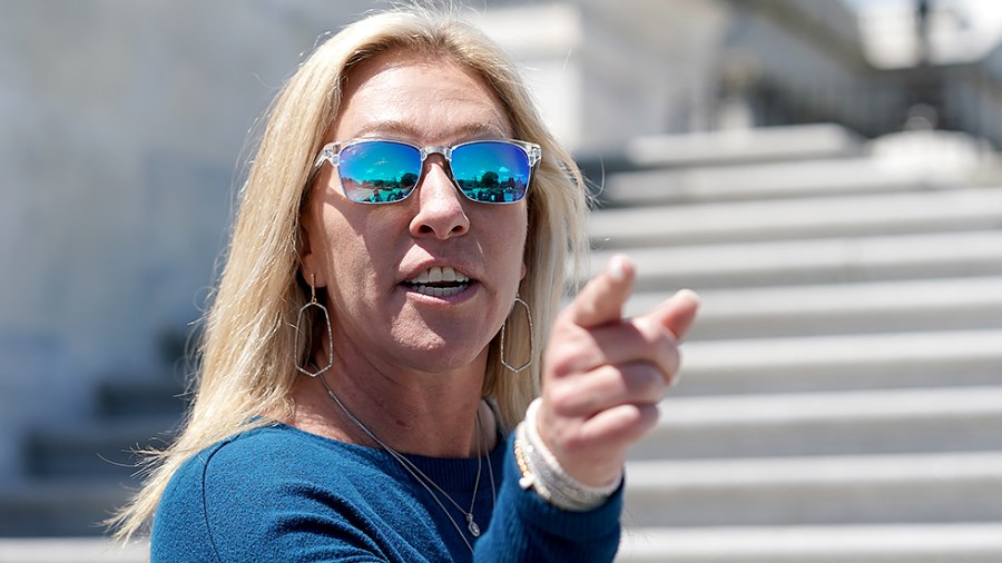 Rep. Majorie Taylor Greene (R-Ga.) speaks to reporters on her way to a vote series on May 13