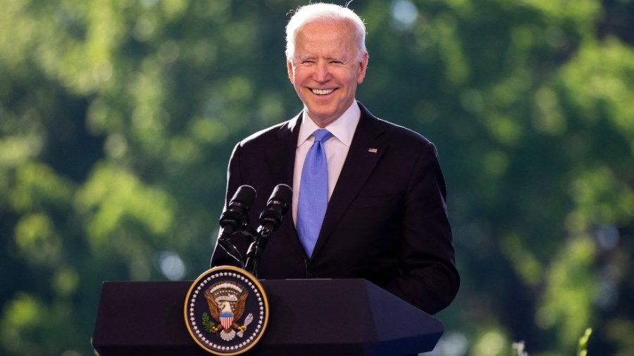 President Biden smiles during press conference in Geneva