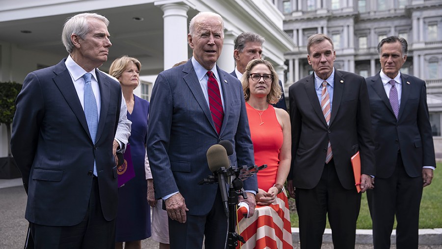 President Biden speaks to reporters outside the White House following a meeting with a bipartisan group of Senators where they reached a deal on the infrastructure plan on June 24