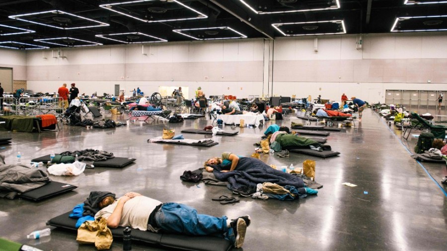 People shelter from extreme heat at the Oregon Convention Center in Portland