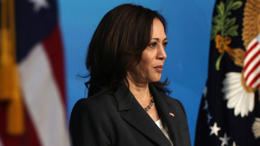 Vice President Harris listens as President Biden speaks on the COVID-19 vaccine efforts in the South Court Auditorium of the White House