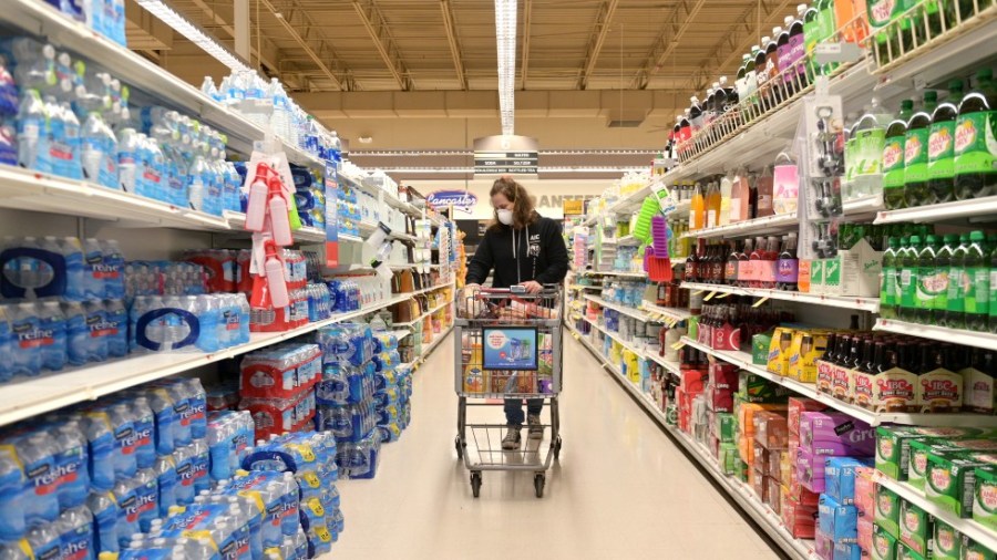 Clark resident Jen Valencia shops for a customer as she supplements her income working for Instacart