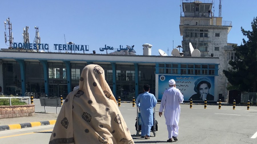 People arrive at the domestic terminal of the Hamid Karzai International Airport of Kabul