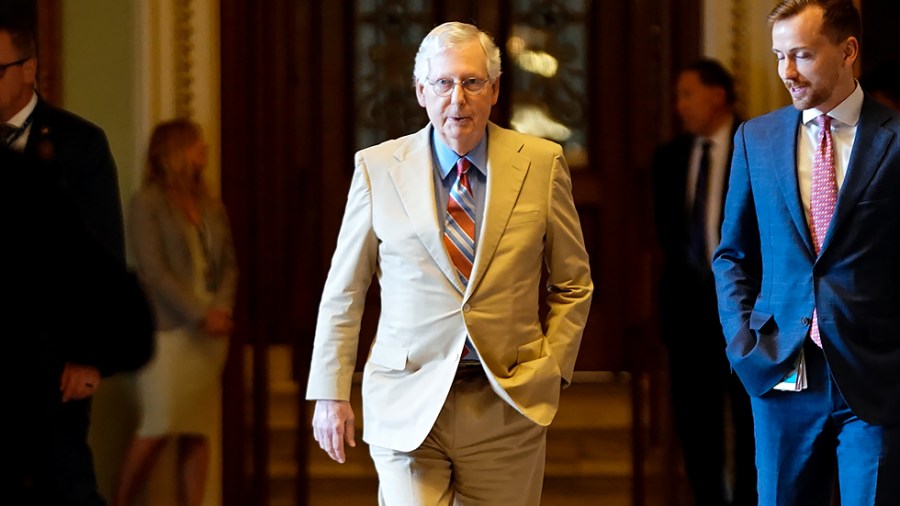 Minority Leader Mitch McConnell (R-Ky.) returns to his office after speaking on the Senate floor on June 14