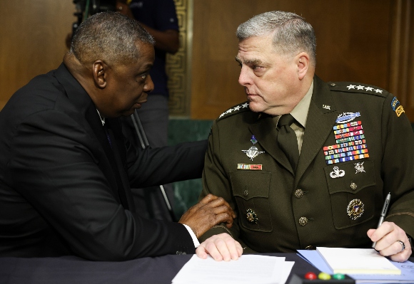 U.S. Defense Secretary Lloyd Austin talks with Joint Chiefs of Staff Chair Gen. Mark Milley