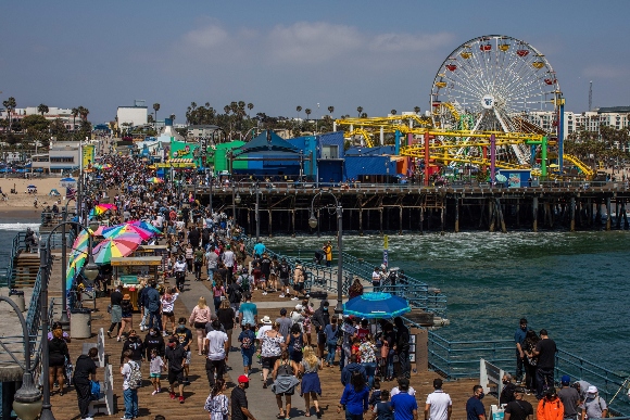 People walk through the Santa Monica pier