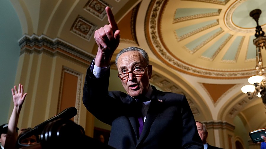 Majority Leader Charles Schumer (D-N.Y.) addresses reporters following the policy luncheon on June 15