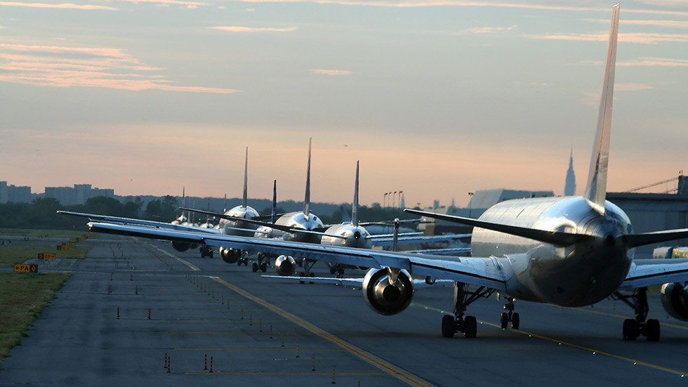 Planes line up on a runway