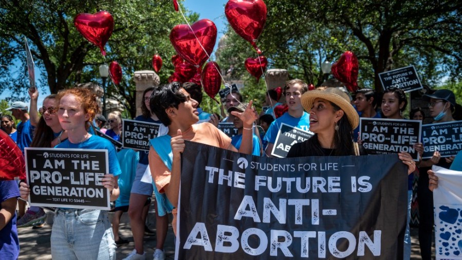 Anti-abortion protesters demonstrate near the gate of the Texas state capitol in Austin