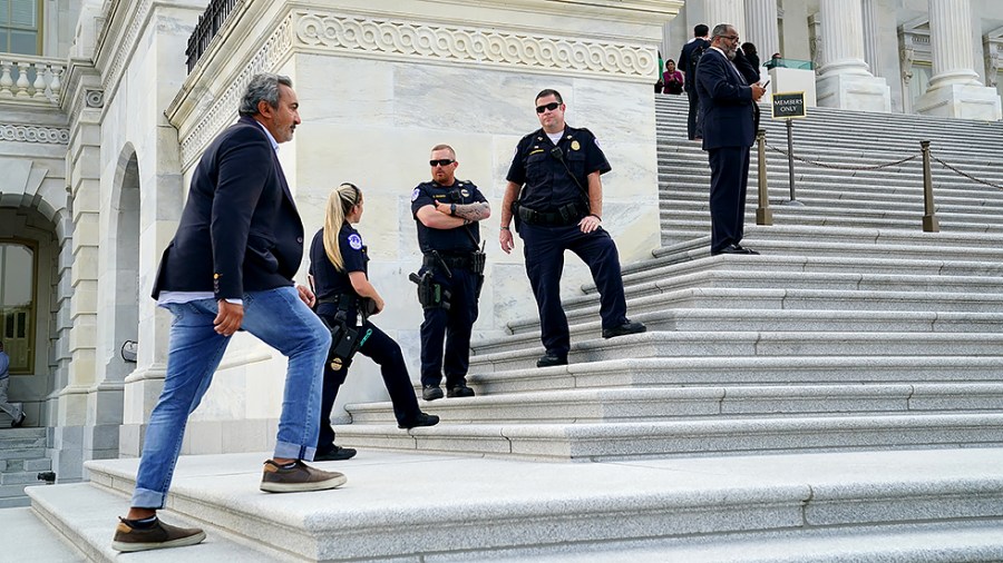 U.S. Capitol Police are seen outside the House Chamber as members arrive for votes on Monday, July 19, 2021.