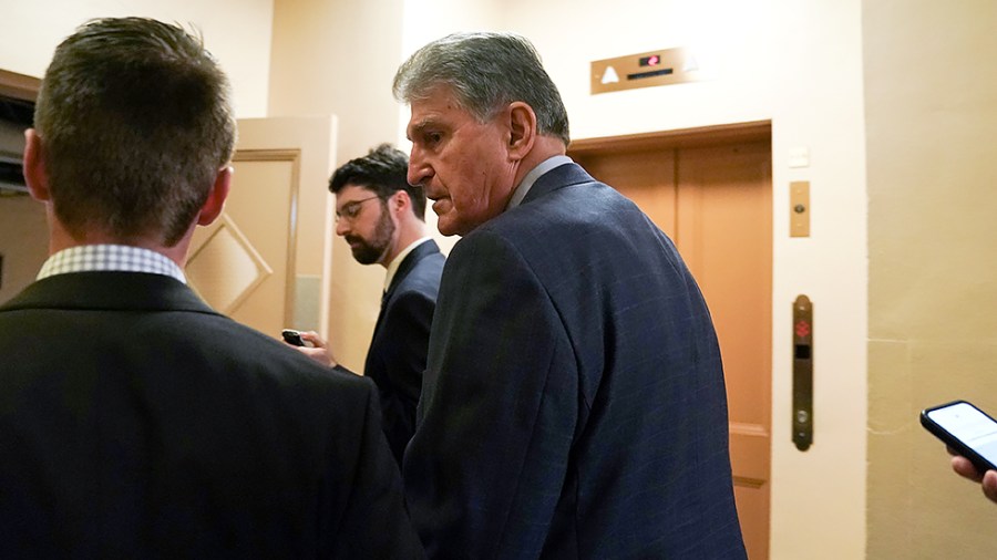 Sen. Joe Manchin (D-W.Va.) speaks to reporters as he arrives for a vote and a meeting with Democrats from the Texas State House on July 15