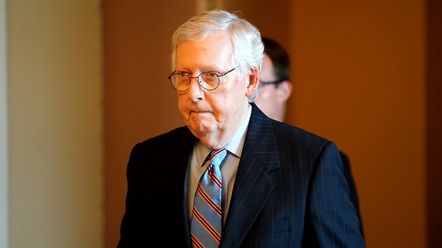 Minority Leader Mitch McConnell (R-Ky.) heads to the Senate Chamber on Wednesday, July 21, 2021.