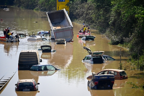 Search and rescue teams are seen on a flooded and damaged part of the highway (A1) on July 17, 2021 in Erftstadt, Germany