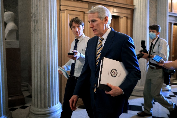 Sen. Rob Portman (R-OH) walks into the Senate Chamber