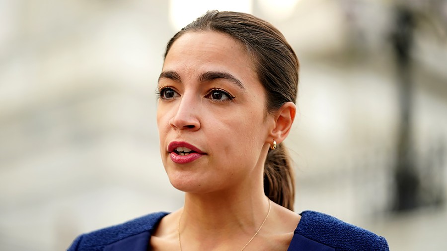 Rep. Alexandria Ocasio-Cortez (D-N.Y.) speaks to a reporter outside the House Chamber during the first vote of the week on Monday, July 19, 2021.