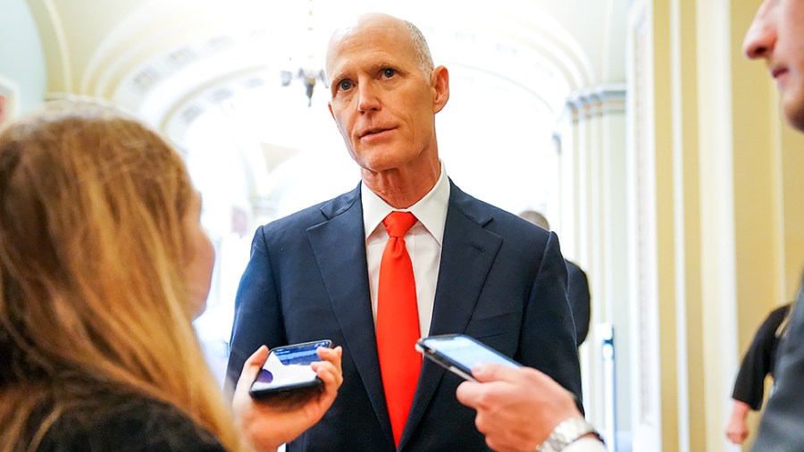 Sen. Rick Scott (R-Fla.) speaks to reporters before heading to the Senate Chamber for a vote on Monday, July 19, 2021.