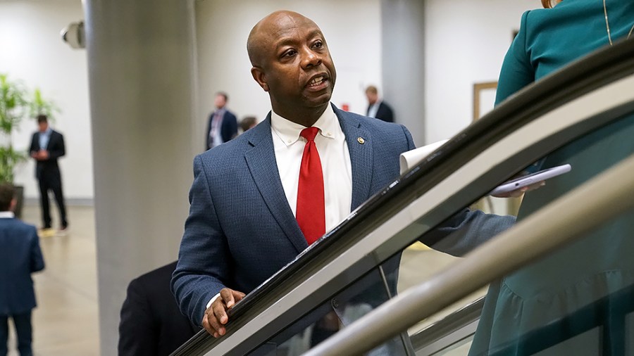 Sen. Tim Scott (R-S.C.) arrives to the Capitol for a vote on Thursday, July 15, 2021.