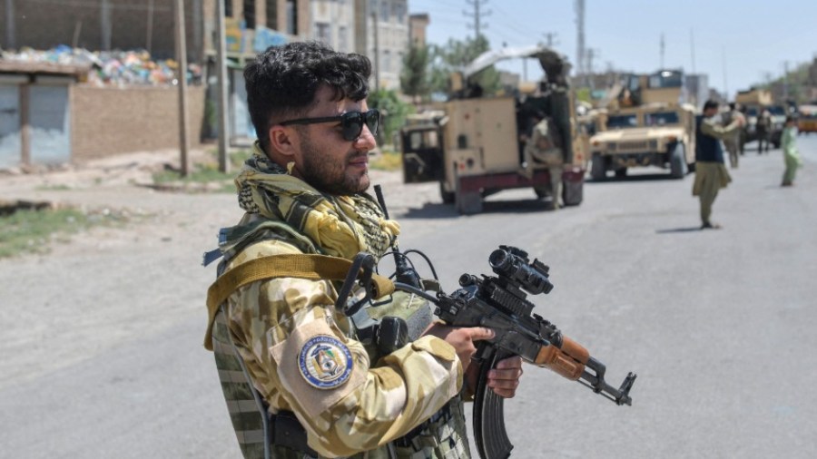 An Afghan National Army commando stands guard in Herat province