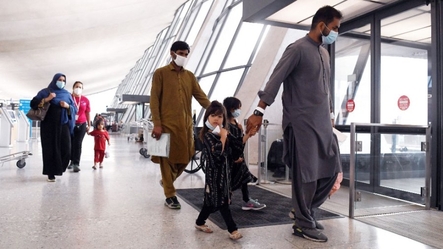 Afghan refugees arrive at Dulles International Airport outside of Washington, D.C.